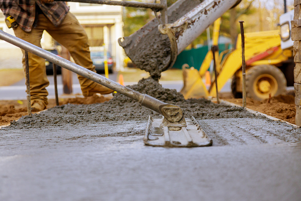 Worker working for concrete pavement for ground construction concrete